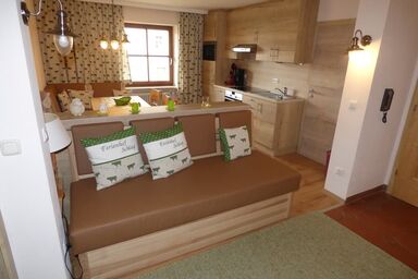 Ferienhof Schlag - Ferienwohnung Muhgemütlich (70qm) mit Kamin und Südbalkon