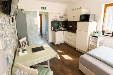 Rottaler Ferienhaus - Rottaler Oachkatzl - Appartement 'Waldwinkel' mit kleiner gemütlicher Terrasse