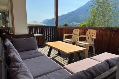 AlpsRelax.ch GmbH - Premium 122 m² Alpen-Ferienwohnung • 6 Personen • Überdachte Terrasse & privater Garten
