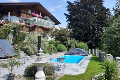 Gemütliche Ferienwohnung in alpiner Umgebung mit einem schönen Garten, ideal für einen Familienurlaub