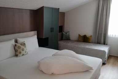 Hotel Garni Tannleger - Family  Suite Aktiv mit Balkon und Gartenblick
